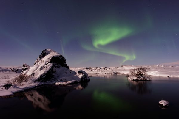 Aurora borealis reflecting from water
